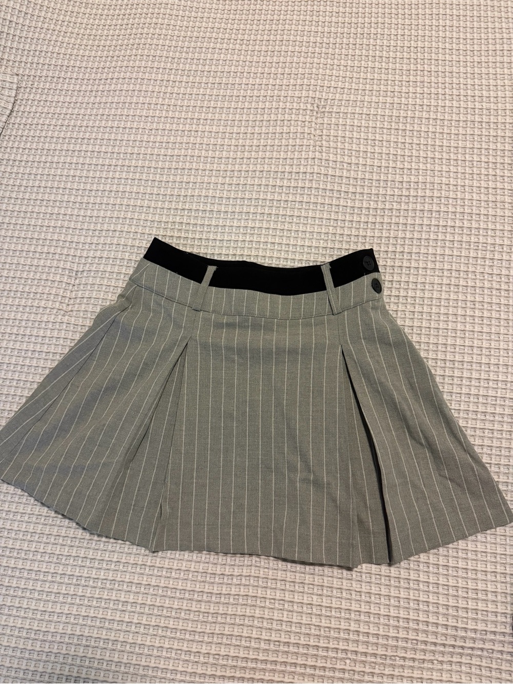 Grey and white pinstripe skirt with black waistband.